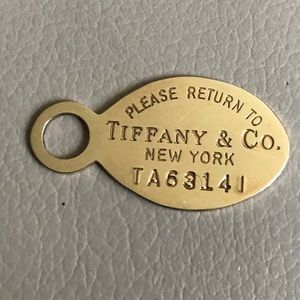 Please Return to Tiffany & Co. 14 Kt Gold Pendant